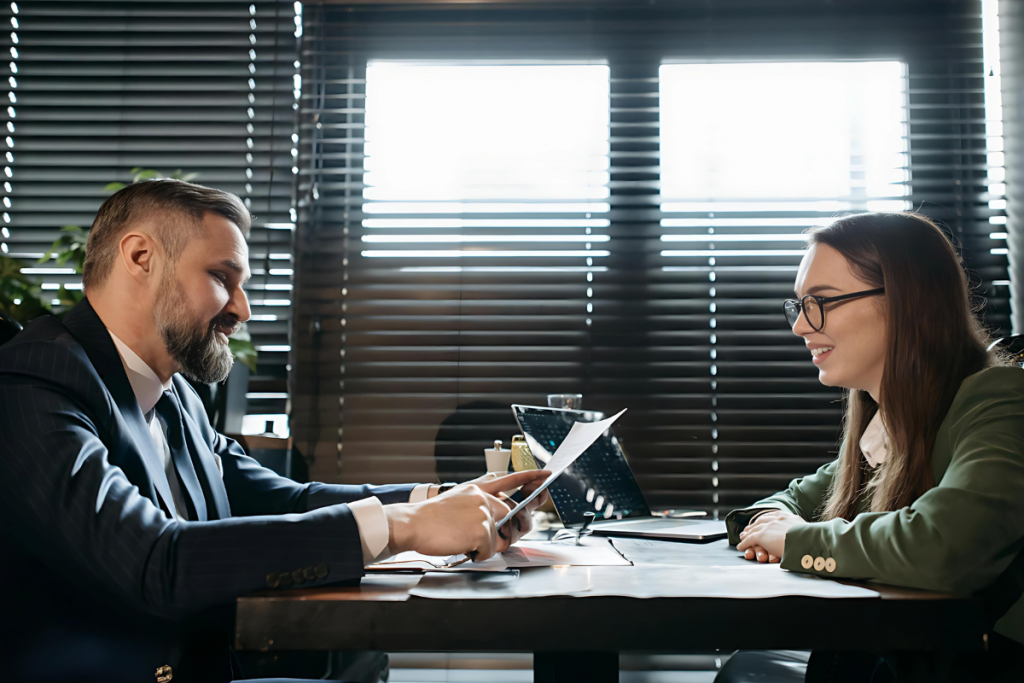 Two people talking at a table