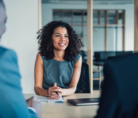 Shot of group of business persons in business meeting. Three entrepreneurs on meeting in board room. Corporate business team on meeting in modern office. Female manager discussing new project with her colleagues. Company owner on a meeting with two of her employees in her office.